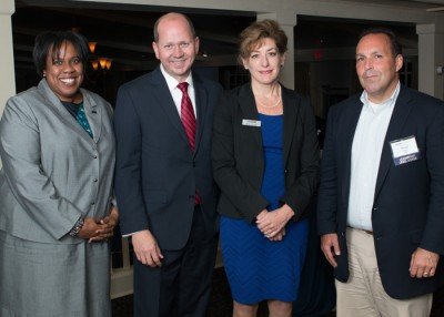 Mo Cotton Kelly with (from left to right) Josh Newton, president of the UConn Foundation, UConn President Susan Herbst, and Dan Toscano '87 (BUS) at the Presidential National Series event on Sept. 18, 2014, in Westport, Conn. (Photo/Defining Photo)