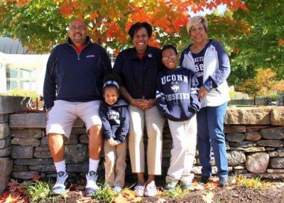 Mo Cotton Kelly and her family in the Husky Plaza at the Alumni Center (from left to right): Mo's husband, James, daughter Kenya, Mo, son Lincoln, and mother Brenda. (Photo/Josh Proulx)