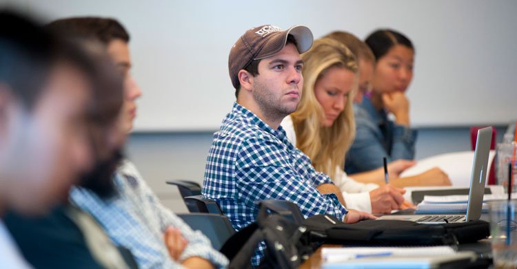 photo of uconn students listening to a lecture