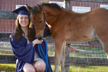 Sam's graduation picture with a UCONN foal from the program