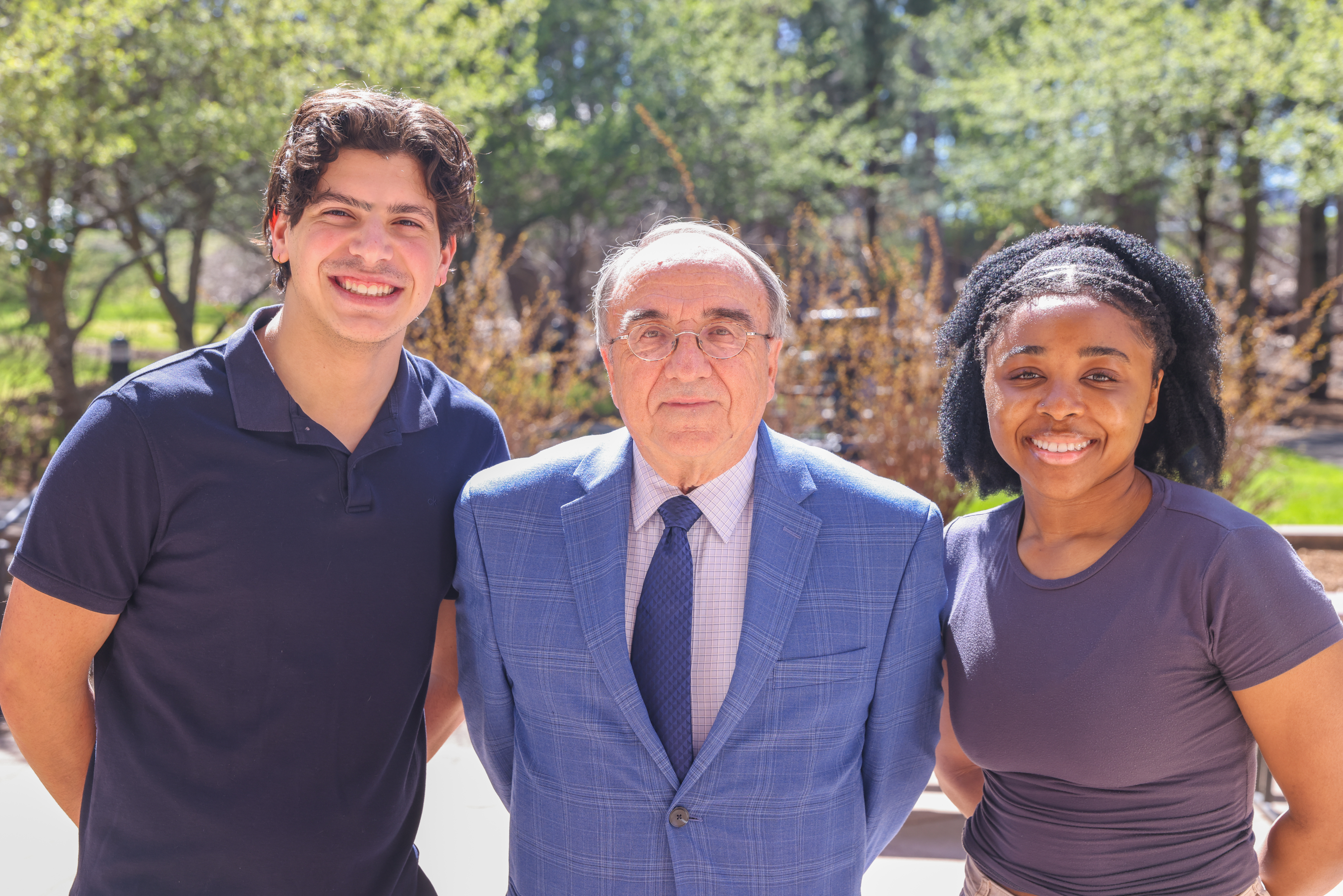 Photo of Peter Petrella with students Justin Guinta ’25 (CLAS) and Mirsha Pierre ’24 (CLAS), the current recipients of his scholarship.